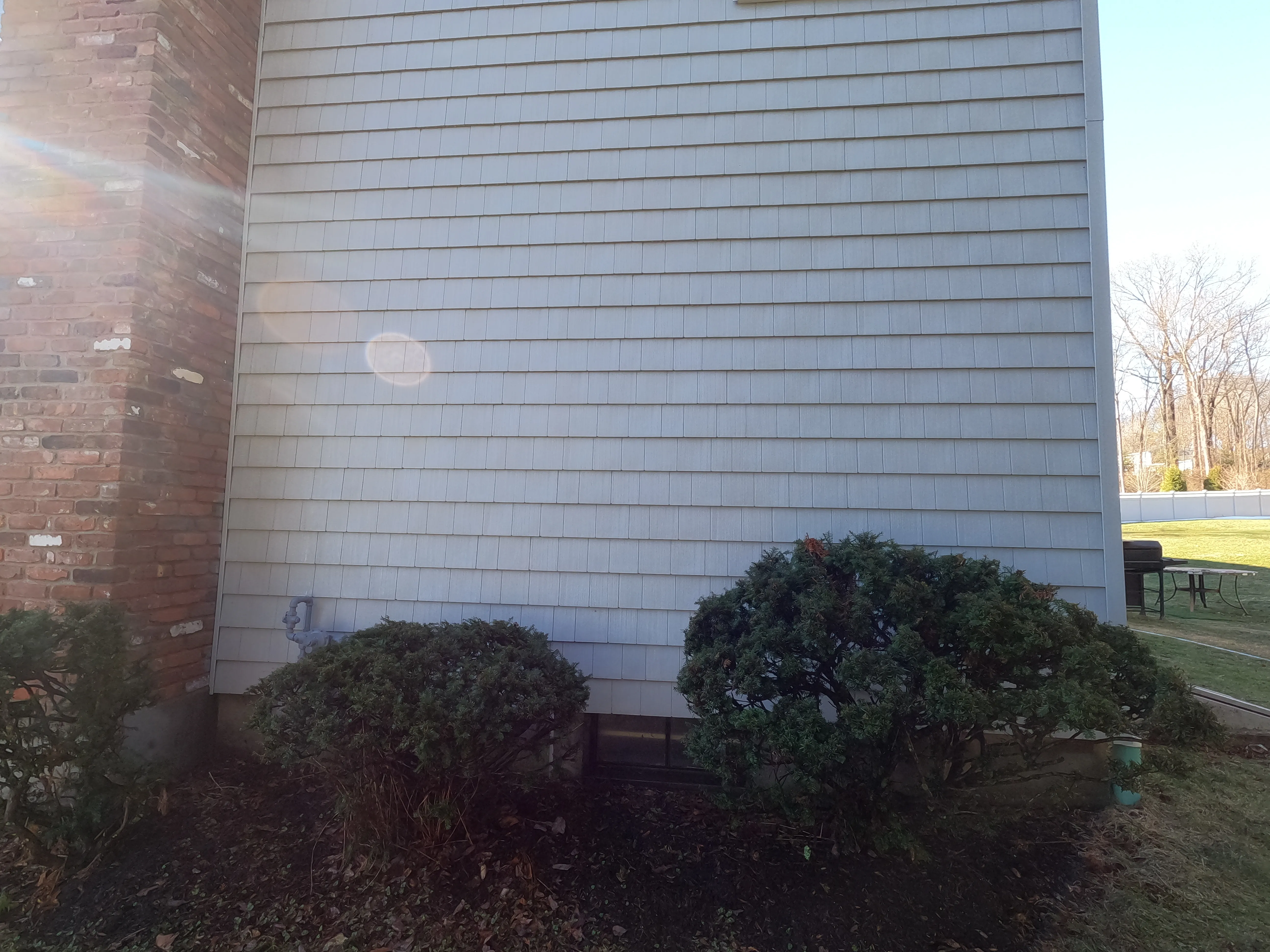 A spotless, freshly cleaned home exterior in Bridgeport, CT after softwashing service.
